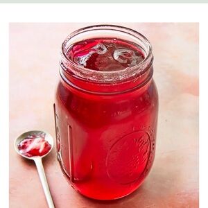 One half pint jar of beauty berry jelly from Yellow Flower Farm. Organic Non gmo